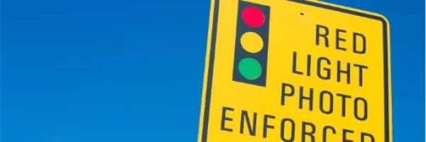How Do I Handle a Red Light Camera Ticket if I Was Not the Driver?