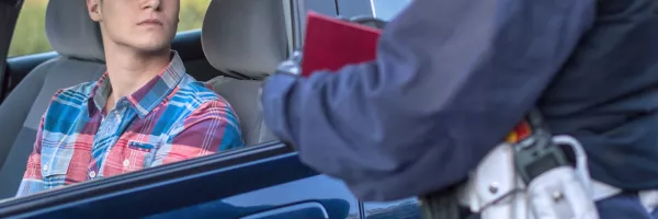 Young man receiving traffic ticket 