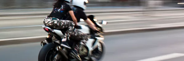 riding on back of motorcycle